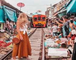 As the train is too close, the travelers are advised not to stand or lean over the tracks in the hope of taking a perfect shot to avoid accident.